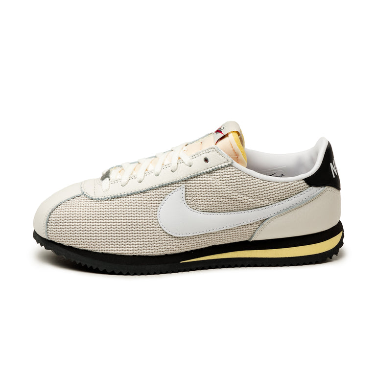 Nike cortez black white and gold top