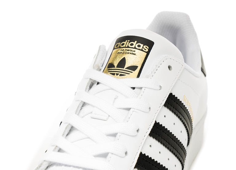 Adidas superstar black gold stripes sales